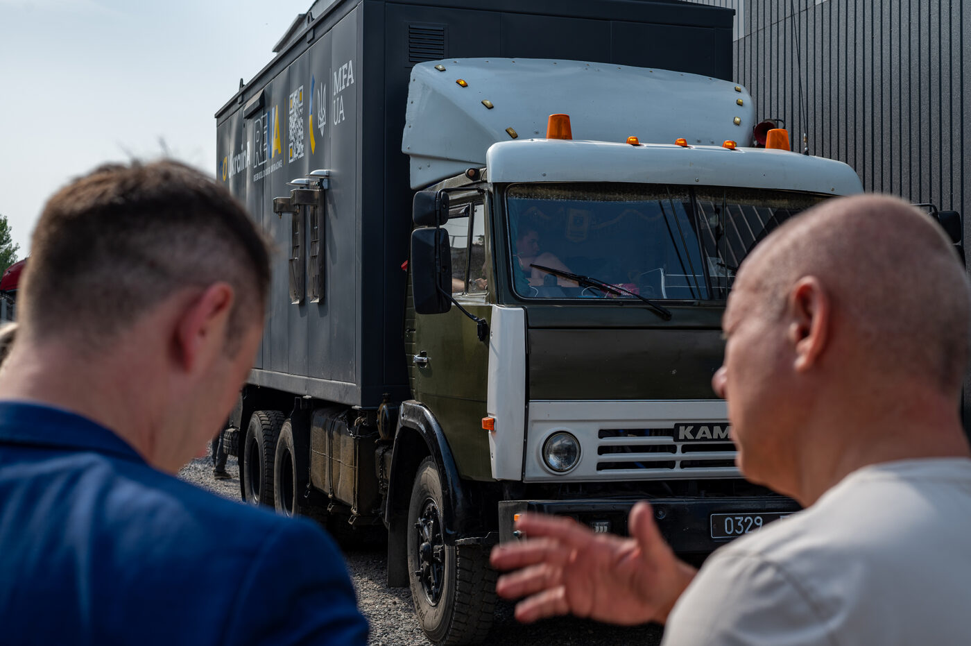 Relief truck and emergency power equipment staged for delivery in Ukraine